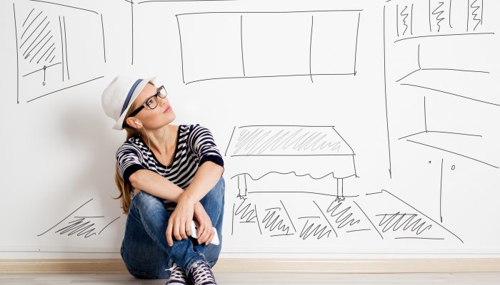 Dreaming woman in headset over drawn living room background