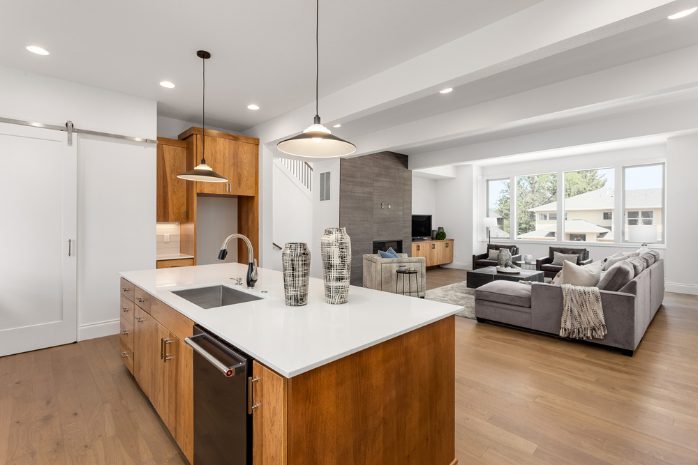 Kitchen and living room in new home with open concept floor plan. ©BM_27