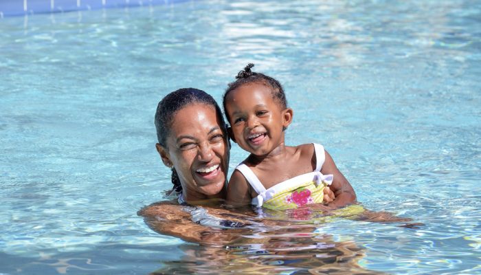 Mom and Daughter enjoying a nice summer day in the swimming pool